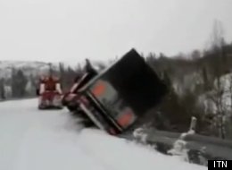 This is the moment a lorry got dangerously close to the edge of a snow-covered mountain road in Norway.