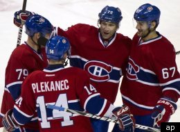 Markov, Cole, Pacioretty et Plekanec célèbrent leur victoire contre le Lightning de Tampa Bay, le 4 avril 2012. (AP)