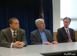 Michigan Gov. Rick Snyder (center) with Treasurer Andy Dillon (right) and Director of Urban Initiatives Harvey Hollins (left) in a media briefing in Detroit April 5, 2012.