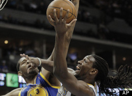 Denver Nuggets' Kenneth Faried, right, shoots against Golden State Warriors' Jeremy Tyler in the first period of their NBA game in Denver on Monday, April 9, 2012. Denver beat Golden State 123-84.(AP Photo/Joe Mahoney)