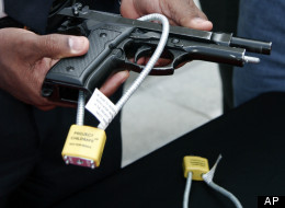 File: New Orleans Police Department Asst. Superintendent Warren Riley demonstrates how to install a gun lock at a news conference in New Orleans Tuesday, March 22, 2005.