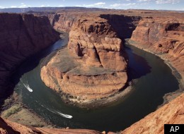 FILE - In this March 5, 2008 file photo, water levels at the Colorado River's Horseshoe Bend begin to rise along the beaches just hours after the Glen Canyon Dam jet tubes began releasing water in Page, Ariz. Hispanic leaders in the West have formed a new group called Nuestro Rio to focus attention on the Colorado River, which has sustained generations of Latinos. The Colorado River system provides municipal water for more than 30 million people in Arizona, California, Colorado, Nevada, New Mexi