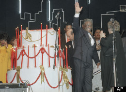Chicago Mayor Harold Washington blows out the candles on his birthday cake during a party for him at Chicago's Navy Pier Tuesday on April 15, 1986, night. Washington was celebrating his 64th birthday. (AP Photo/Charlie Bennett)