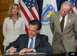Mitt Romney signs legislation to extend the Massachusetts' ban on assault weapons on July 1, 2004.