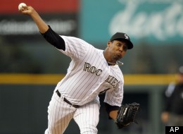 Colorado Rockies starting pitcher Juan Nicasio delivers a pitch to San Diego Padres leadoff batter Will Venable in the first inning of a baseball game in Denver on Wednesday, April 18, 2012. (AP Photo/David Zalubowski)
