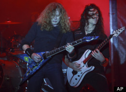 Dave Mustaine, left, and Cris Broderick, of the U.S. trash metal band Megadeth perform in concert in La Paz, Bolivia, Friday Nov. 25, 2011. (AP Photo/Juan Karita)