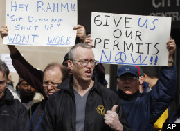 Andy Thayer, center, joins other activists outside the City of Chicago Central Hearing Facility Tuesday, March 27, 2012, in Chicago, as they appeal a city denial of their request to hold a march during the upcoming NATO Summit. Delegations for dozens of world leaders visiting Chicago for the NATO Summit will test city resources, a city transportation official testified during the hearing. Organizers had promised to file a lawsuit if the city ruled against them. (AP Photo/M. Spencer Green)