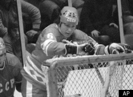 NHL All-Stars Bobby Clarke heads for the ice behind the Soviet Nationals net in the third period of the third game in the Challenge Cup series in New York on Sunday, Feb. 12, 1979. Behind him are Soviet defencemen Sergie Babinov (4) and Valeri Vasilyev (6). The Soviet team won 6-0 and took the cup 2-1 in games. (AP Photo/Bill Kostround)