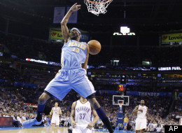 Denver Nuggets forward Corey Brewer dunks in front of Oklahoma City Thunder guard Derek Fisher (37) during the first quarter of an NBA basketball game in Oklahoma City, Wednesday, April 25, 2012. (AP Photo/Sue Ogrocki)