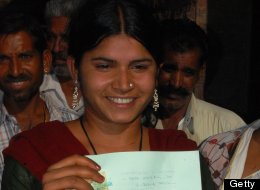Indian woman Laxmi Sargara, 18, holds her certificate of the annullment of her marriage outside the court in Jodhpur on April 24, 2012. (STR/AFP/Getty Images)