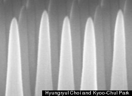Through a process involving thin layers of material deposited on a surface and then selectively etched away, the MIT team produced a surface covered with tiny cones, each five times taller than their width. This pattern prevents reflections, while at the same time repelling water from the surface.
