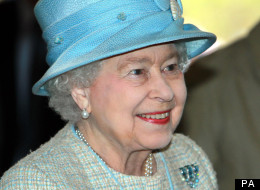 The Queen was mobbed this afternoon when hundreds of royal fans cheered as she toured a rain-swept event staged in her honour.