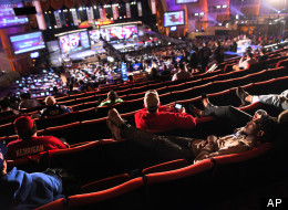 A fan rests in the mezzanine nearing the end of the third round of the NFL football draft at Radio City Music Hall, Friday, April 27, 2012, in New York. (AP Photo/John Minchillo)