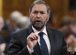 NDP Leader Tom Mulcair isn't saying how much the NDP was forced to pay back after Elections Canada found they violated political financing laws.