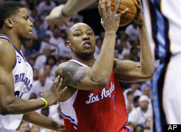 Los Angeles Clippers' Caron Butler, center, works the ball around Memphis Grizzlies' Rudy Gay, left, and Marc Gasol (33), of Spain, during the first half in Game 1 of a first-round NBA basketball playoff series, Sunday, April 29, 2012, in Memphis, Tenn. (AP Photo/Danny Johnston)