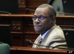 Illinois Rep. Derrick Smith, D-Chicago, is seen on the House floor during session Tuesday, April 17, 2012 at the Illinois State Capitol in Springfield, Ill. Smith has been largely absent from the capital since his March 13 arrest on a federal bribery charge. He was indicted on April 10, 2012 for allegedly accepting $7,000 in exchange for his support of a grant application. (AP Photo/Seth Perlman)