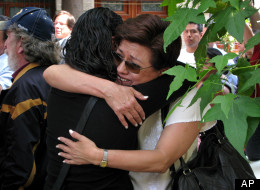 Journalists embrace each other during a demonstration condemning the alleged murderer of fellow journalist Regina Martinez in Mexico City, Sunday, April 29, 2012. (AP Photo/Marco Ugarte)