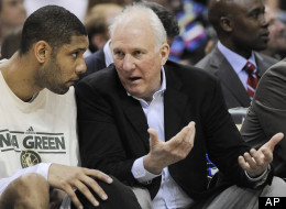 San Antonio Spurs head coach Gregg Popovich, right, talks to Tim Duncan during the second half of an NBA basketball game against the New Orleans Hornets, Friday, April 6, 2012, in San Antonio. San Antonio won 128-103. (AP Photo/Darren Abate)