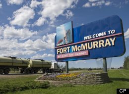 A large welcome sign greets traffic travelling north on Alberta highway 63 as it enters the town at the centre of Canada's oil boom, Fort McMurray.File from 2006.(THE CANADIAN PRESS/Bayne Stanley)