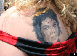 One lady shows off Michael Jackson's face on her shoulder..
