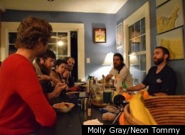 Members of Synchronicity share a meal inside their communal West Adams home. (Molly Gray/Neon Tommy)