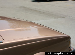 Police in Fort Wayne, Indiana say a man and woman were seen strapping 4 children to the hood of a car (not pictured) in a liquor store parking lot, then driving away. <a href=