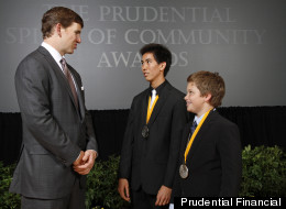 Eli Manning with two of 2012's Prudential Spirit of Community Awards honorees.