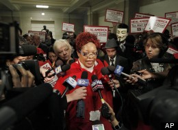 Registered Nurse Martese Chism, with National Nurses United talks to the media, during a protest by nurses at City Hall, Monday, Oct. 24, 2011, in Chicago.
