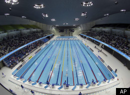 This March 9, 2012 file photo shows swimmers competing in the men's 1500 meter freestyle during the British Swimming Championship selection trials and Olympic test event at the London 2012 Olympic Aquatics Centre at the Olympic Park in London. Wednesday, April 18, 2012 marks the 100-day countdown to the London Olympics. As London organizers put the finishing touches on the venues and city officials prepare for an invasion of fans, athletes around the world are training for the big moment. (AP Ph