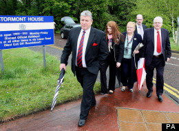 Stanley McComb (left), Cathy Wilson (second left), Patsy Gallagher, John Fox and Michael Gallagher (right), representing the Omagh Families, arrive at Stormont
