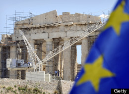 Workers on scaffolding work in front of the Parthenon Temple at the Acropolis archaeological site in Athens on May 9, 2012. (LOUISA GOULIAMAKI/AFP/GettyImages)