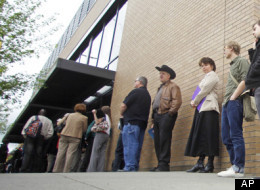 In this April 24, 2012, photo shows job seekers waiting in line during a job fair, In Portland, Ore