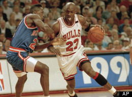 Chicago Bulls' Michael Jordan drives on the New York Knicks' Gerald Wilkins during the first quarter of game seven of the Eastern Conference semi-finals in Chicago, May 17, 1992.