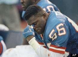 New York Giants linebacker Lawrence Taylor (56) rests on the bench near the end of season opener against the San Francisco 49ers at Giants Stadium in East Rutherford, N.J. on Sunday, Sept. 7, 1992.