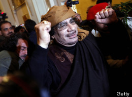 Libyan strongman Moamer Kadhafi gestures as he arrives at the Rixos hotel in the capital Tripoli on March 8, 2011. (MAHMUD TURKIA/AFP/Getty Images)