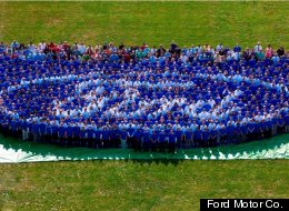 Ford owns its own logo again, after mortgaging it in 2006. Ford employees form the logo on the lawn of the company's Dearborn, Mich., headquarters.