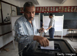 An Egyptian man casts his ballot inside a polling station in Cairo on May 23, 2012, during the country's historic presidential election, the first since a popular uprising toppled Hosni Mubarak. (Photo by MARCO LONGARI/AFP/GettyImages)