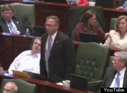 State Rep. Mike Bost (R-Murphysboro) screamed and threw papers into the air during a House floor debate on state pension reform Tuesday.