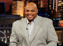 Marcelo Godoy, left, of the Spanish-language network SPACE, laughs with Inside the NBA analyst Charles Barkley while taping a promotional spot on the set at the TNT studios in Atlanta. (AP Photo/Erik S. Lesser)
