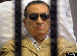 Hosni Mubarak sits inside a cage in a courtroom during his verdict hearing in Cairo on June 2, 2012. (STR/AFP/GettyImages)