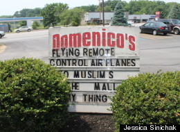 Domenico's owner apologizes for this controversial sign placed outside of the restaurant.
