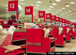 A cashier stands at a Target checkout line. Flickr user <a href=