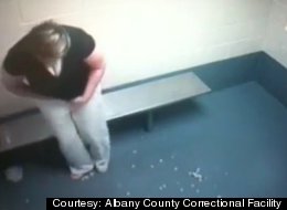 Andrea Amanatides in a holding cell at the Albany County Correctional Facility on Tuesday falls a condom filled with 256 prescription pills falls out of her vagina where she had them stored.