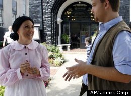 In this Saturday, June 9, 2012 photo, Barry Hatfield, right, dressed as Johnse Hatfield and Lynee Starr, left, as Roseanna McCoy discuss the history of the Hatfield-McCoy feud in front of the Coal House during the Hatfield-McCoy Reunion in Williamson, W.V.