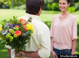 Men are more likely to shell out if their date is attractive, a study finds.