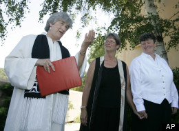 In this June 20, 2008 file photo, the Rev. Jane Spahr, left, a Presbyterian minister, performs a same-sex marriage for Sherrie Holmes, center, and Sara Taylor, at the Marin Civic Center in San Rafael, Calif. The church's highest court later found Spahr guilty of misconduct for officiating the marriage.