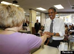 U.S. President Barack Obama buys ice cream at Deb's Ice Cream and Deli in Cedar Rapids, Iowa, July 10, 2012.