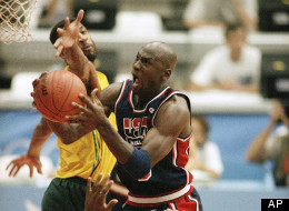 USA's Michael Jordan takes the ball to the hoop past Brazil's Josuel Aristides Santos at the XXV Summer Olympic Games in Barcelona, Friday, July 31, 1992.
