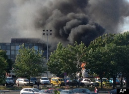Smoke rises into the sky after an explosion at Burgas airport, outside the Black Sea city of Burgas, Bulgaria, some 400 kilometers (250 miles) east of the capital, Sofia, Wednesday, July 18, 2012. (AP Photo/ Burgasinfo)
