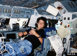 Floating freely on the flight deck, Sally Ride communicates with ground controllers in Houston during her STS-7 mission in June 1983.